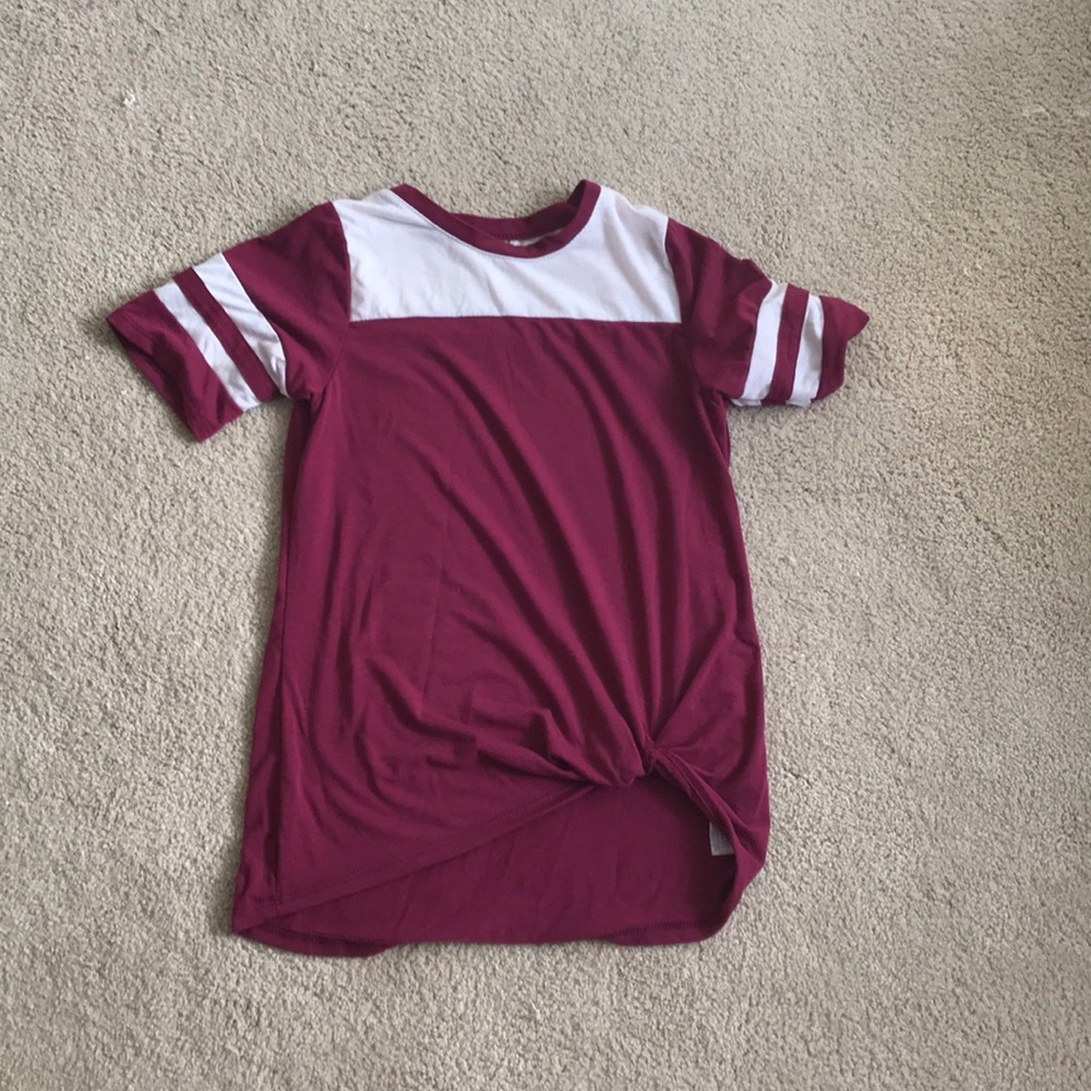 A youth shirt with a knot on the front